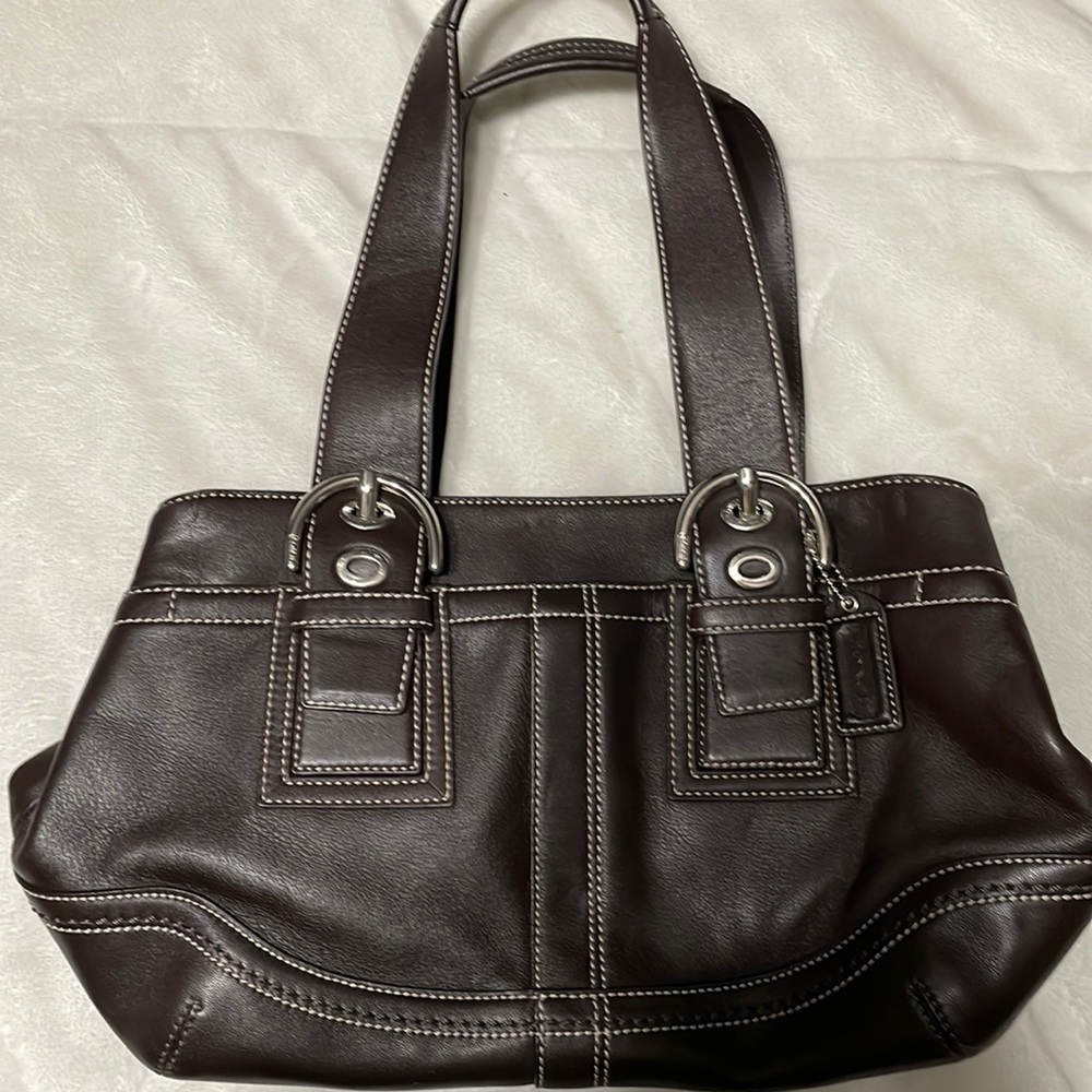 Dark brown, used, medium size Coach purse. Used but very good condition.